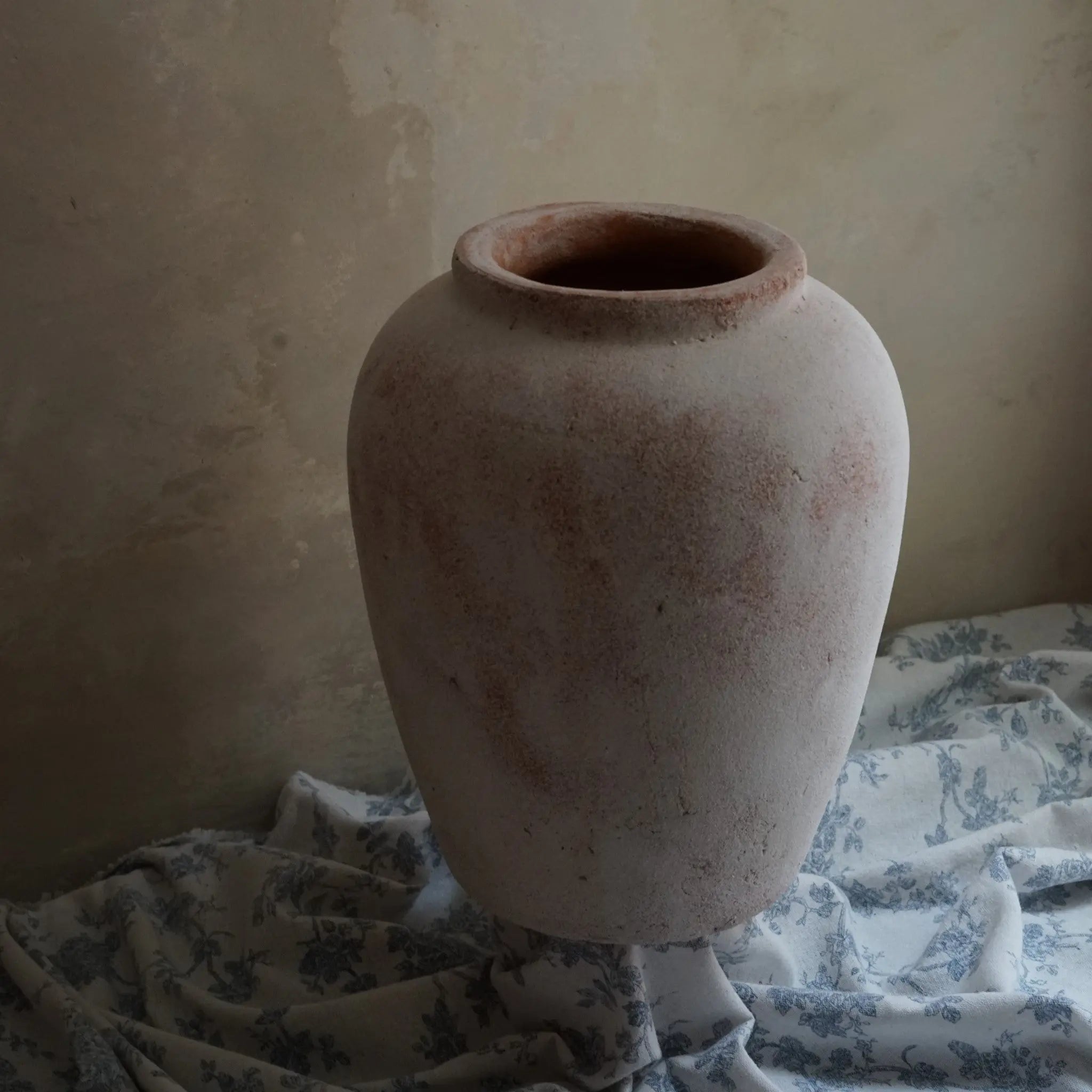 a terracotta vase with an oil painting-like texture.