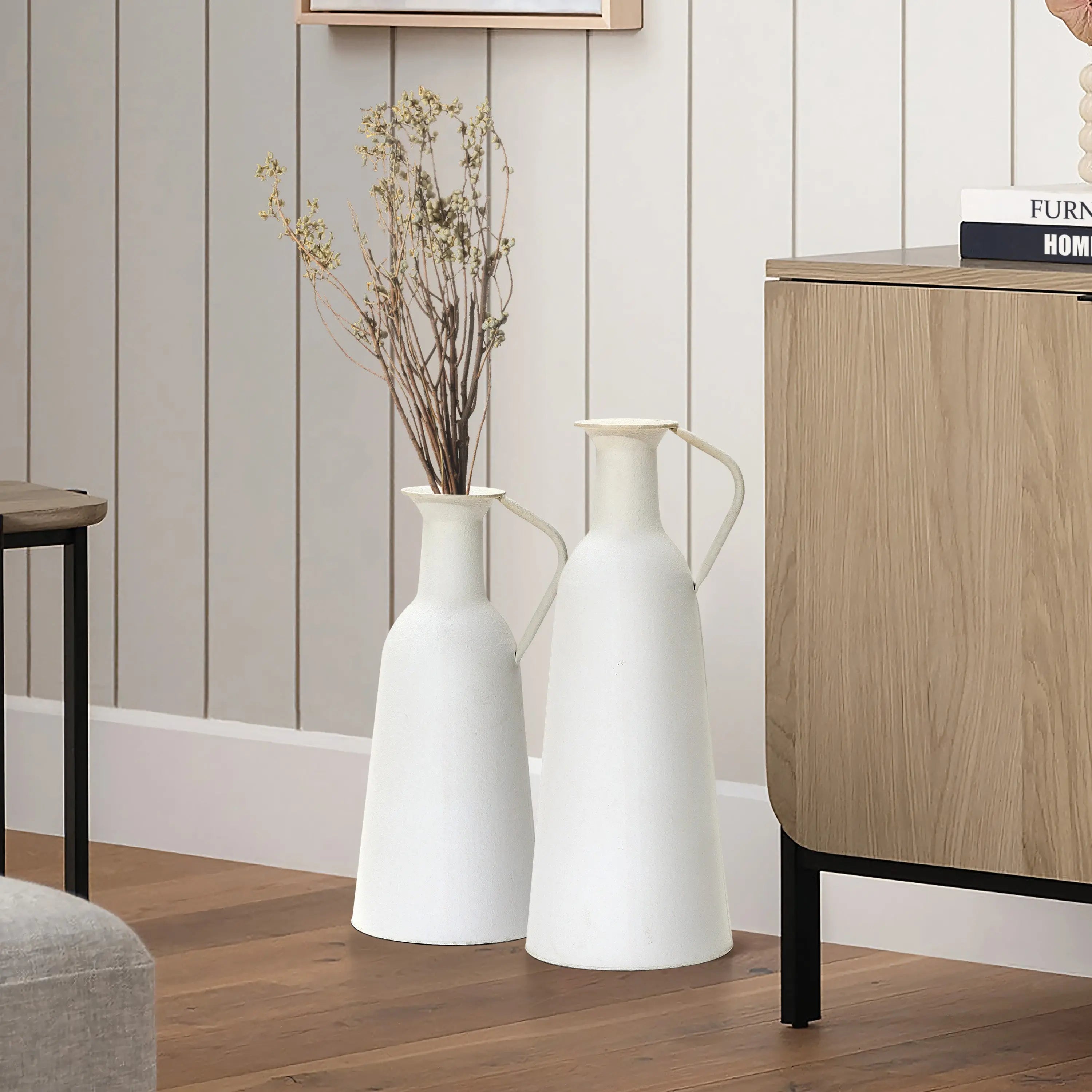 two metal pots beside the desk